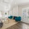 Cozy resident lounge featuring teal accent chairs, fireplace, and natural lighting at apartments in East Baton Rouge.