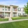 Two-story apartment buildings with balconies and private patios surrounded by green landscaping in East Baton Rouge.