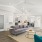 Stylish resident clubhouse with modern seating, coffee bar, and workspace area in Baton Rouge apartment community.