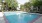 Large swimming pool with large pool deck	