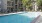 Large swimming pool with large pool deck	